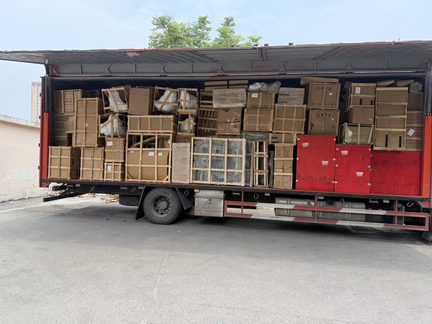Truck packed with protected wooden crates of auto parts