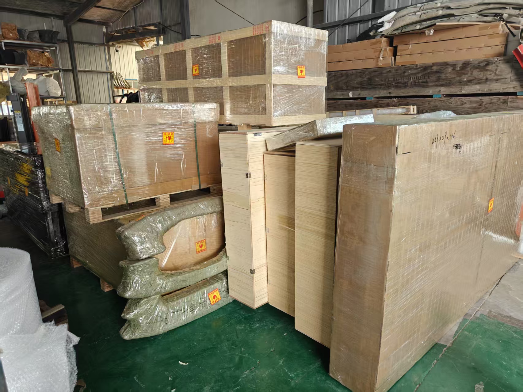 Large EV body components protected in export crates